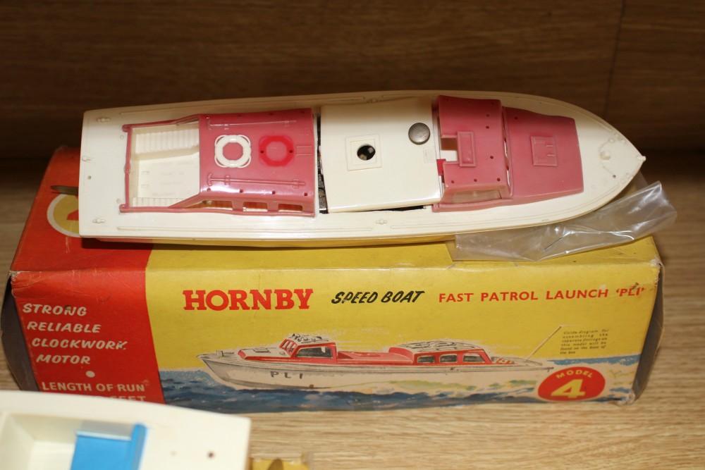 A boxed Sutcliffe model tinplate clockwork nautilus submarine, a boxed Scalex Hunter motor gun boat and two Hornby plastic bodied speed